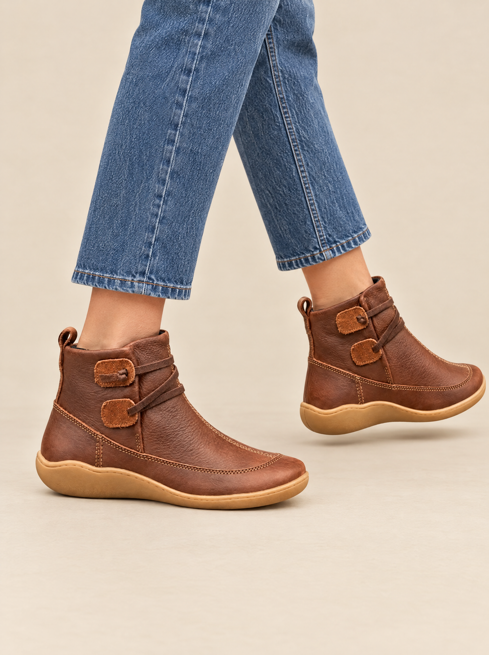 Cora women's slip-on ankle boots in brown – worn with jeans