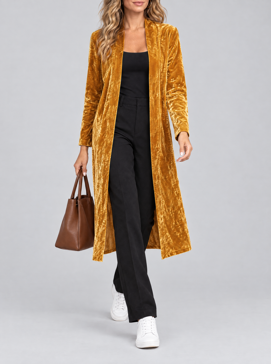 Ottilie long velvet coat in gold, worn with black pants